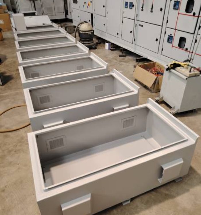 Image of empty electrical cabinet on the factory floor.